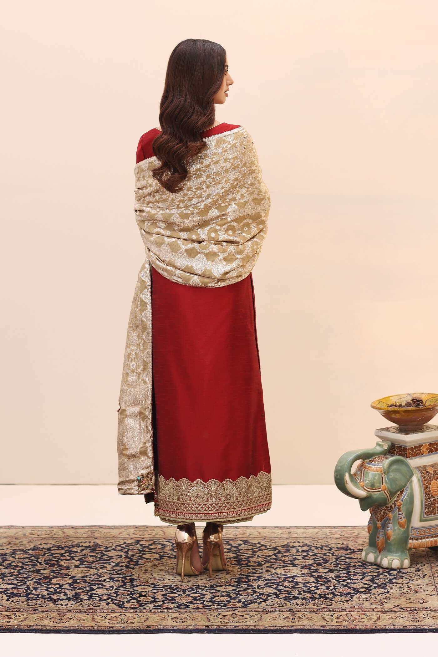 Model wearing a red ENCHANTED AURORA SHAWL dress from Musferah Saad's Ethereal Embrace Shawl Collection '23, highlighting Pakistani clothes online in the UK.