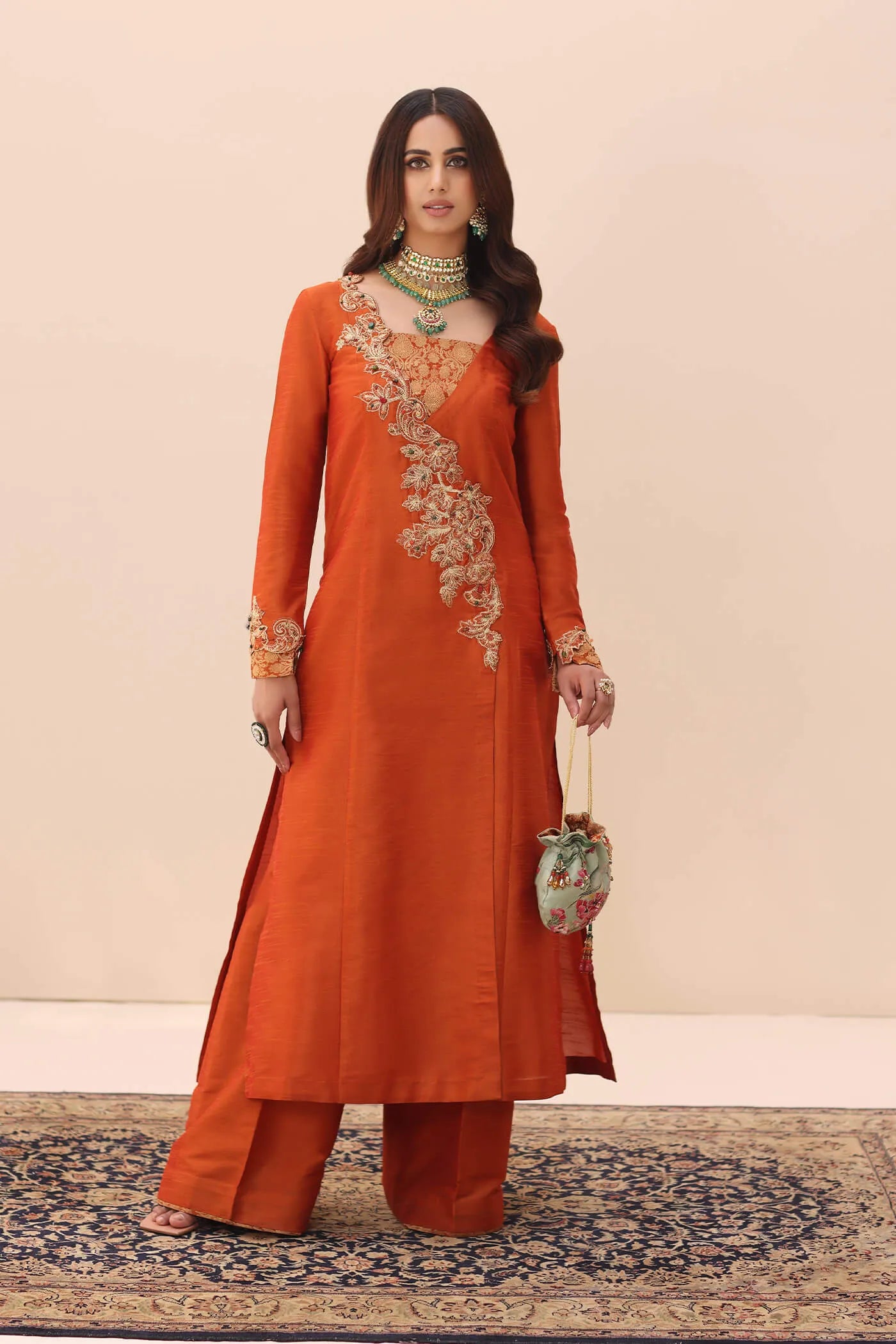 Model wearing Ethereal Embrace Shawl Collection's TANGERINE AURA SHAWLL, an equisite mold by Musferah Saad UK, Pakistani Clothes UK.