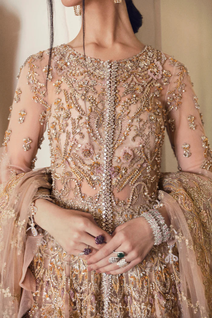 Model wearing blush pink heavily embellished gown Elveera from Mysie By Tahira Chiolite II, Pakistani luxury pret available online in UK.