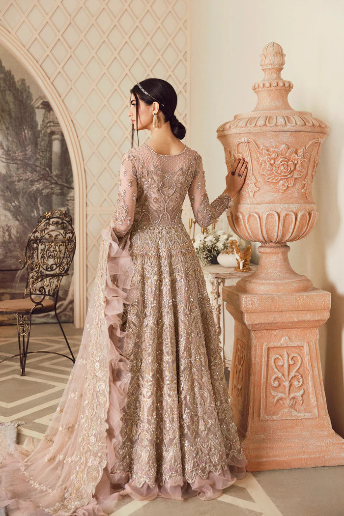 Model wearing blush pink heavily embellished gown Elveera from Mysie By Tahira Chiolite II, Pakistani luxury pret available online in UK.