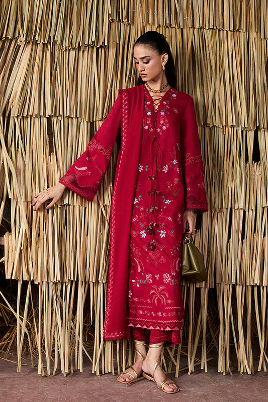 Model wearing Nivvi by Suffuse in deep red, a printed and embroidered Pakistani luxury pret outfit – shop Pakistani clothes online in UK.