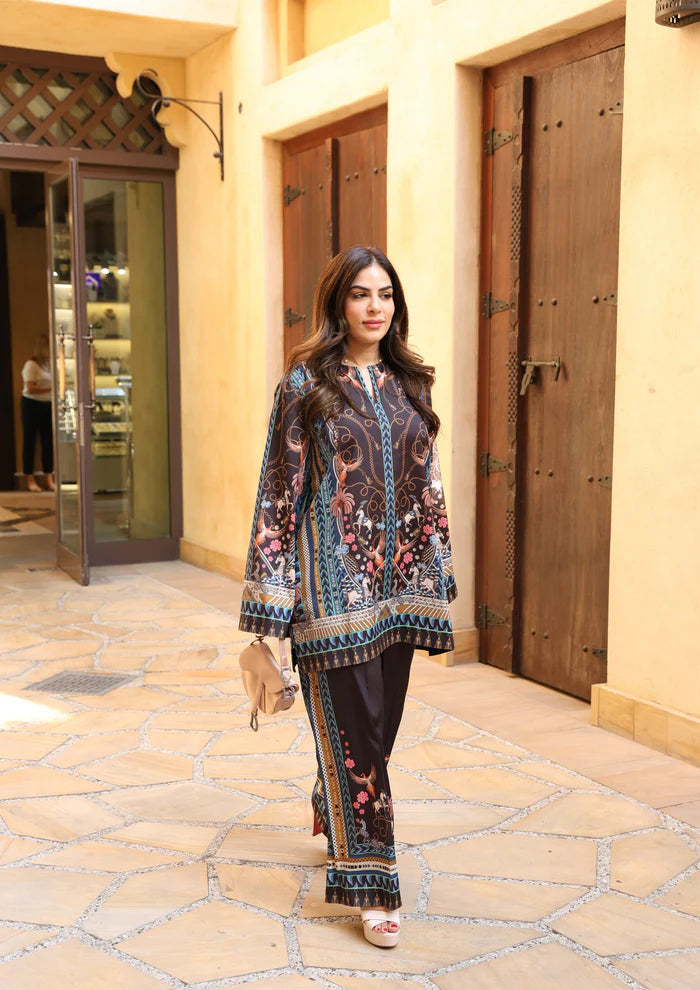 Model wearing black co-ord set with multicolour floral and geometric print from Saira Rizwan, Pakistani Luxury pret, Pakistani clothes online in UK.