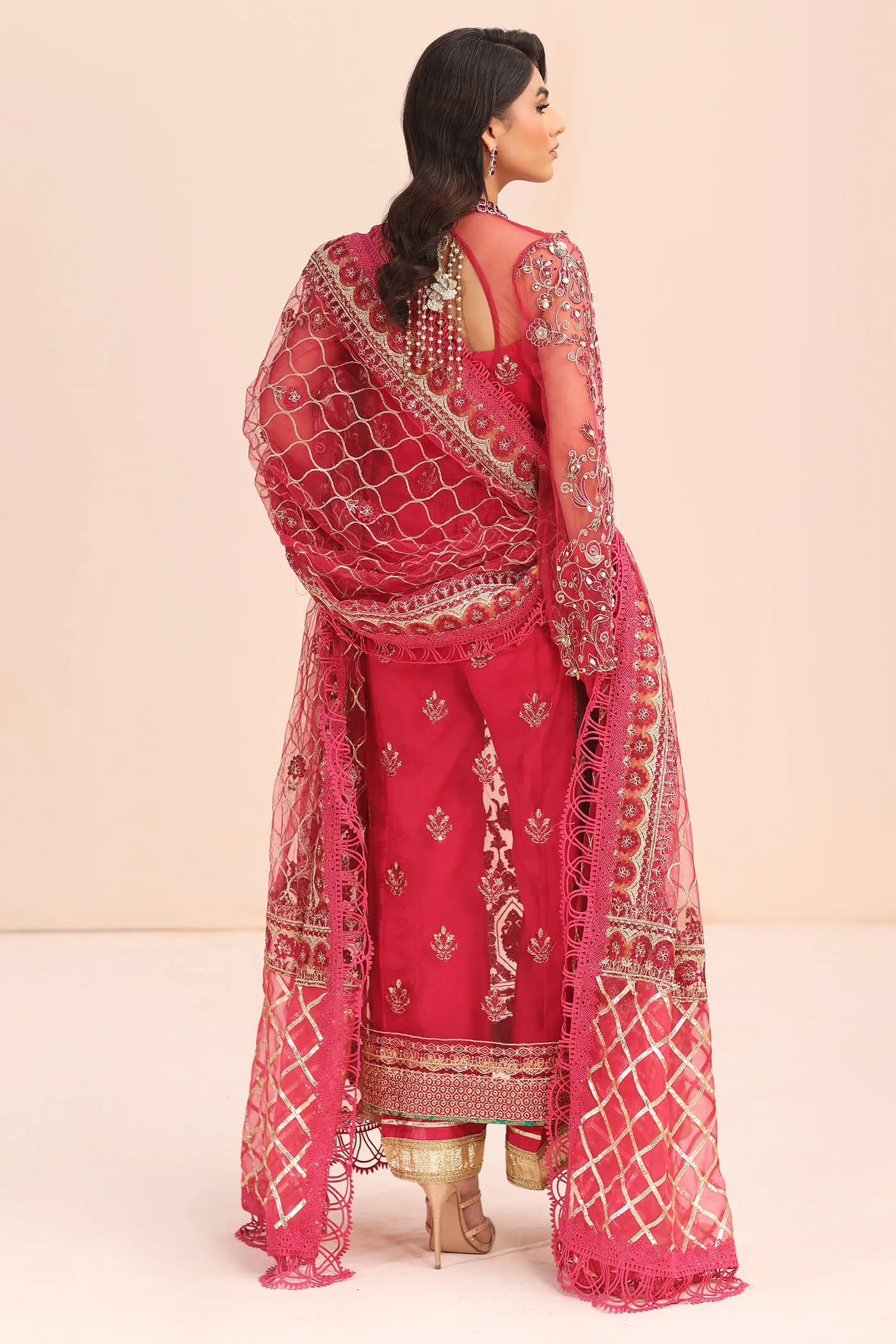 Model in Musferah Saad Fantasia pink Pakistani wedding dress, UK.