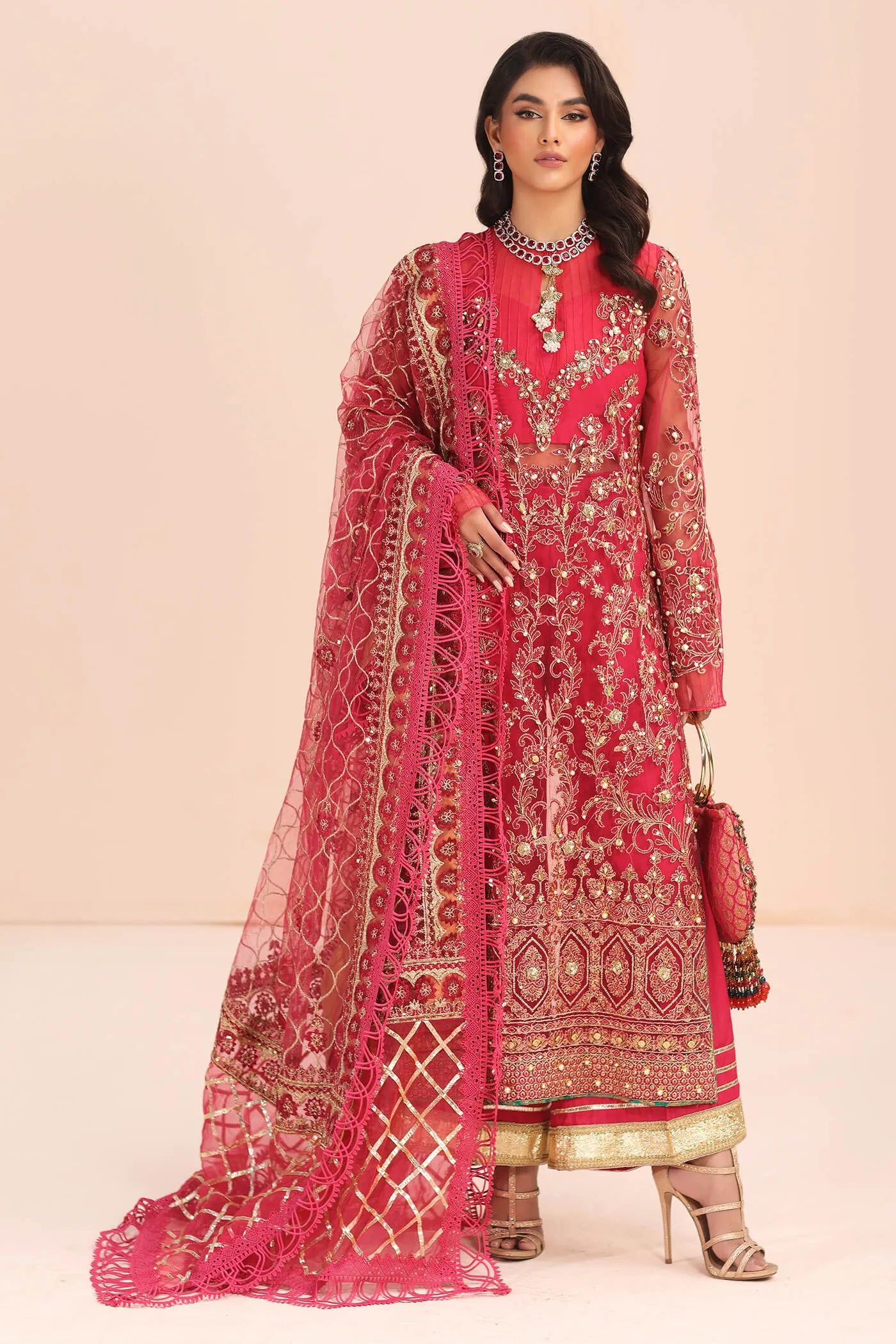 Model in Musferah Saad Fantasia pink Pakistani wedding dress, UK.