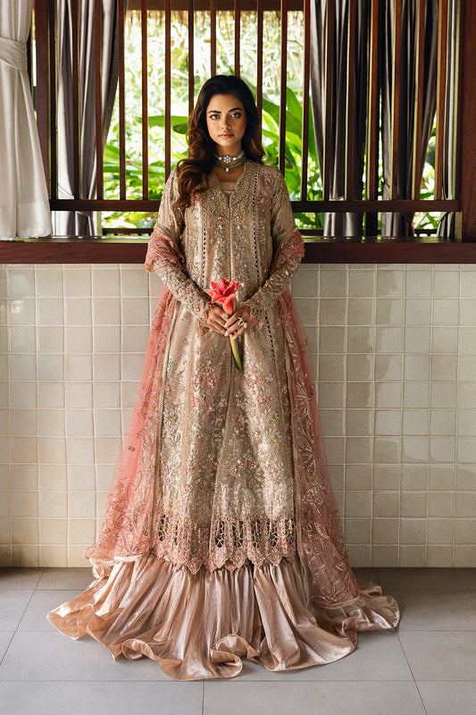 Model wearing Saira Rizwan ROHANA-SRF25-03 in champagne gold with pastel embroidery – Pakistani luxury pret, shop online in UK.