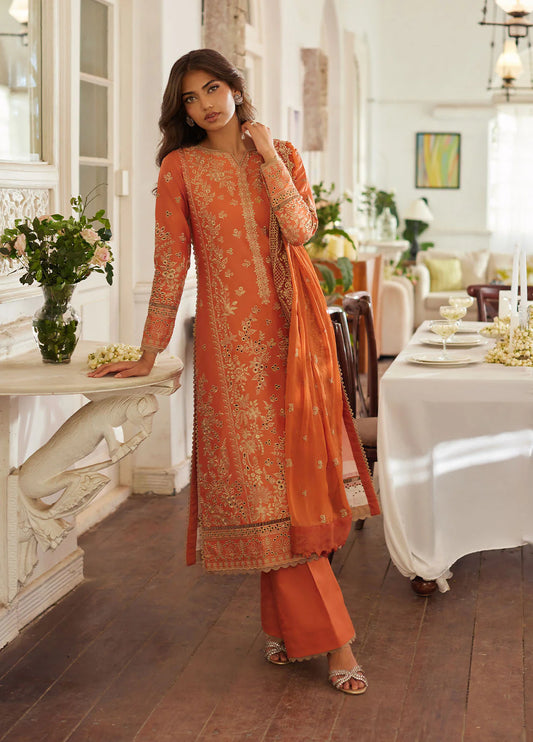 Model wearing rust orange Solara from Gulaal Lumiere Chikankaari Lawn, Pakistani luxury pret and Pakistani clothes online in UK.
