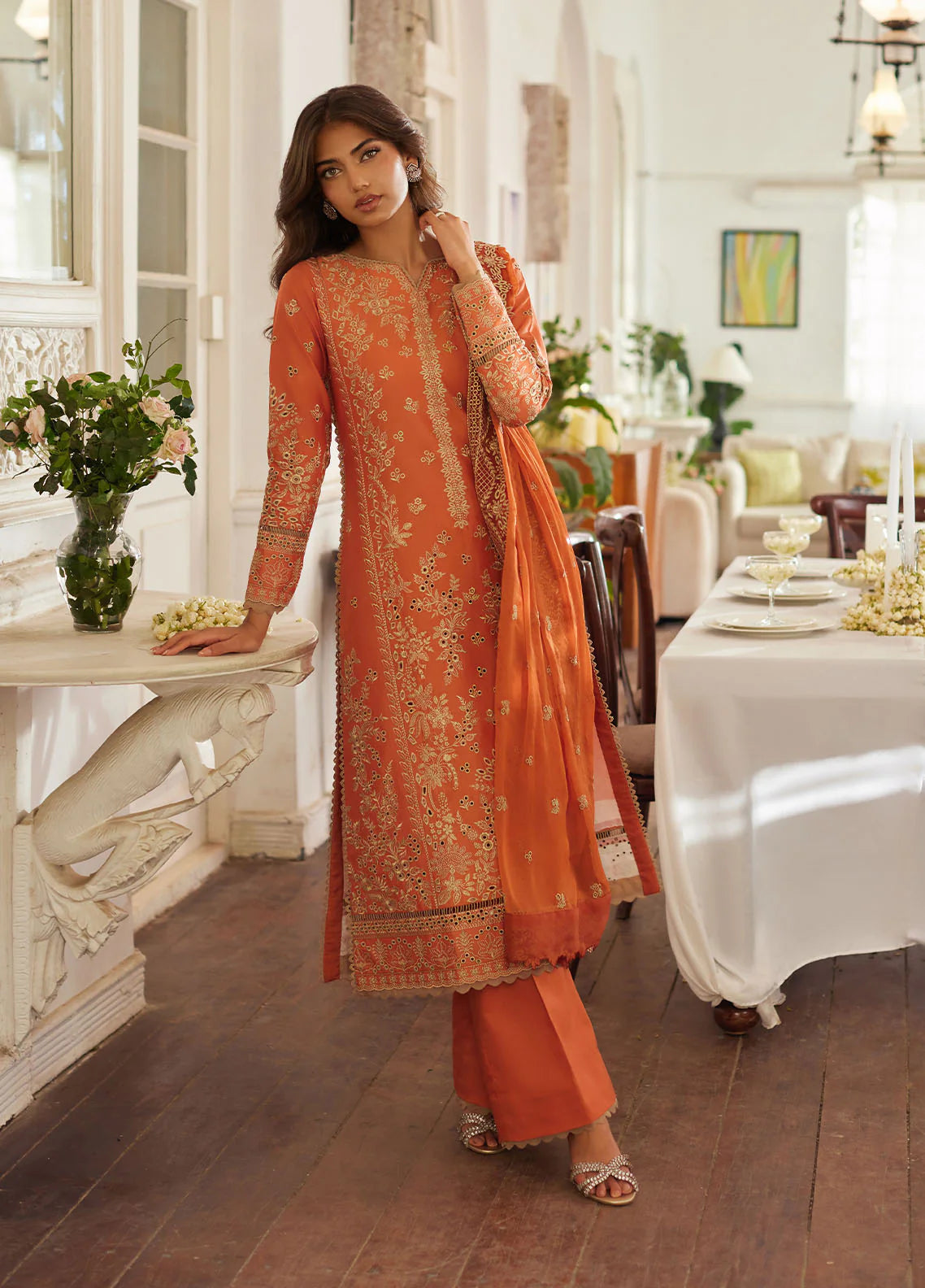 Model wearing rust orange Solara from Gulaal Lumiere Chikankaari Lawn, Pakistani luxury pret and Pakistani clothes online in UK.