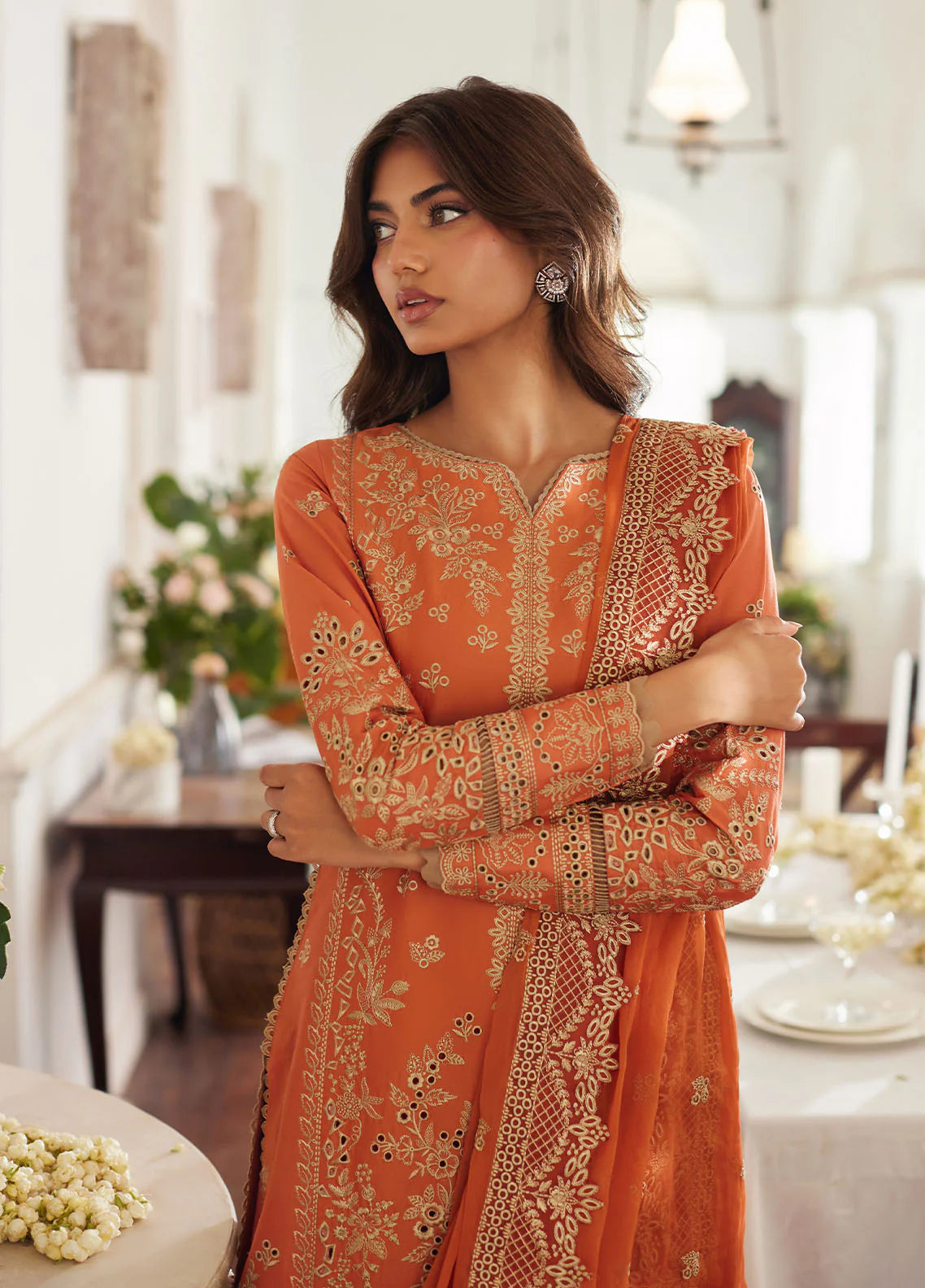 Model wearing rust orange Solara from Gulaal Lumiere Chikankaari Lawn, Pakistani luxury pret and Pakistani clothes online in UK.