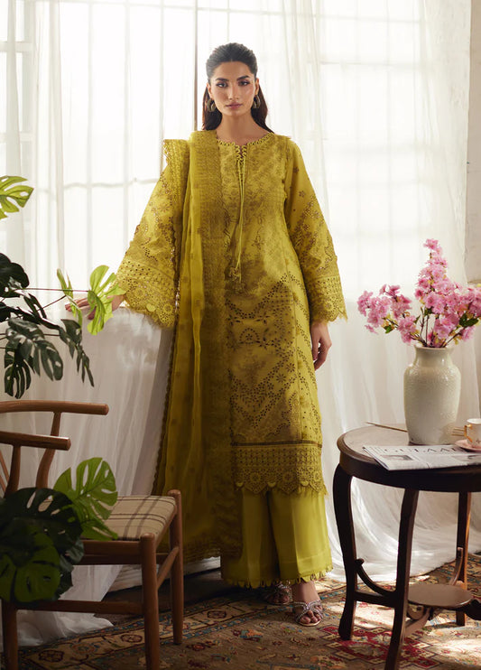 Model wearing mustard yellow Aurelia from Gulaal Lumiere Chikankaari Lawn, Pakistani luxury pret and Pakistani clothes online in UK.