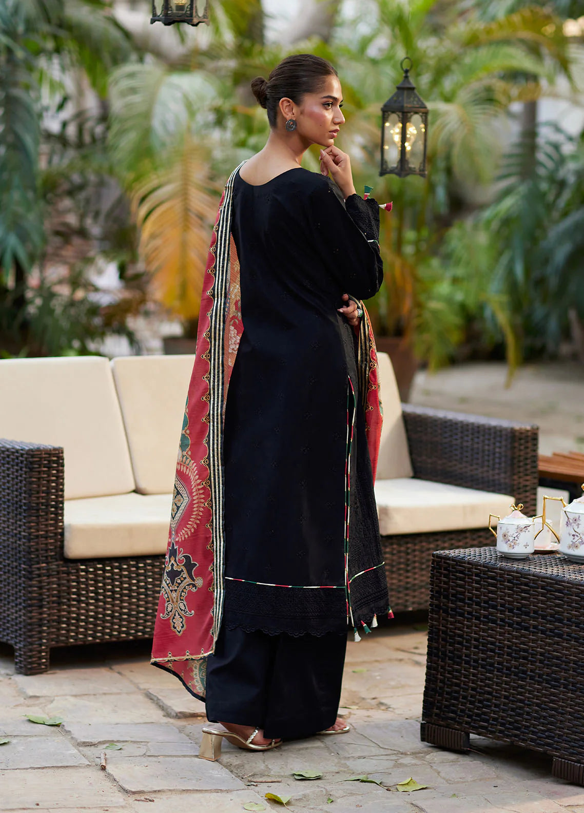 Model wearing black Solene from Gulaal Lumiere Chikankaari Lawn, Pakistani luxury pret and Pakistani clothes online in UK.