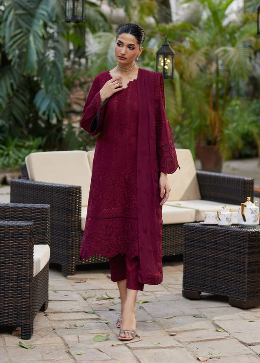 Model wearing deep maroon Reina from Gulaal Lumiere Chikankaari Lawn, Pakistani luxury pret and Pakistani clothes online in UK.
