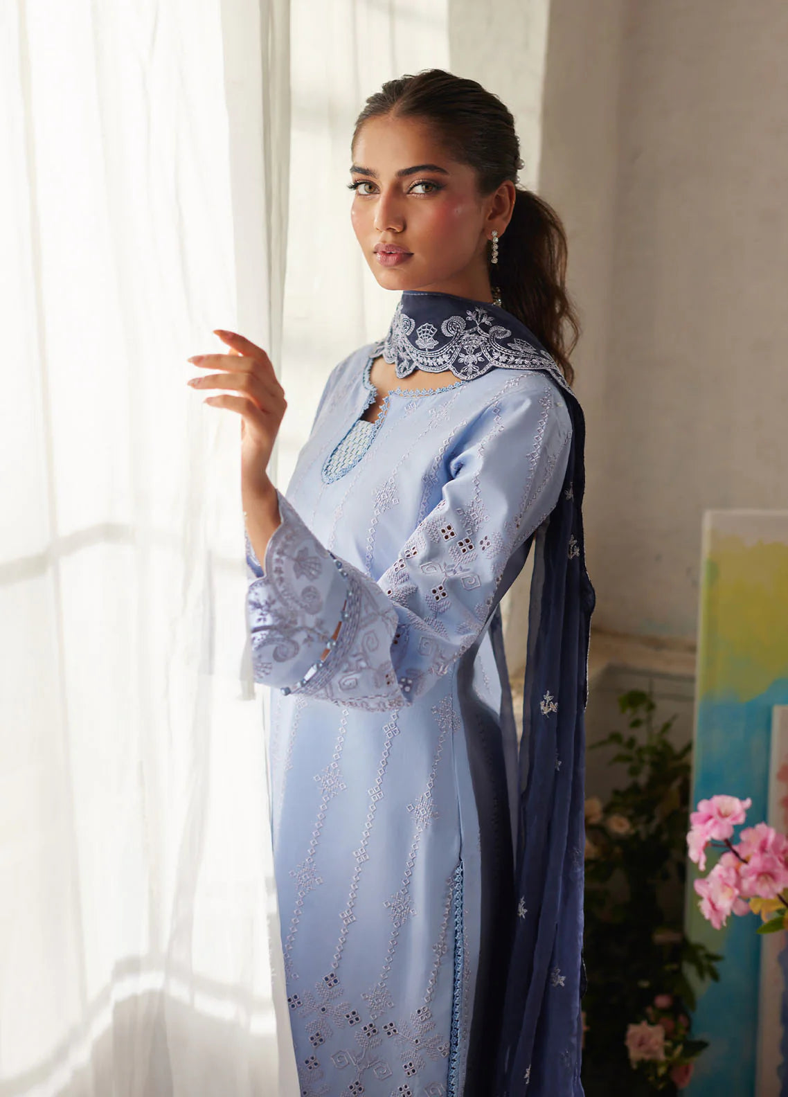 Model wearing powder blue Zorya from Gulaal Lumiere Chikankaari Lawn, Pakistani luxury pret and Pakistani clothes online in UK.