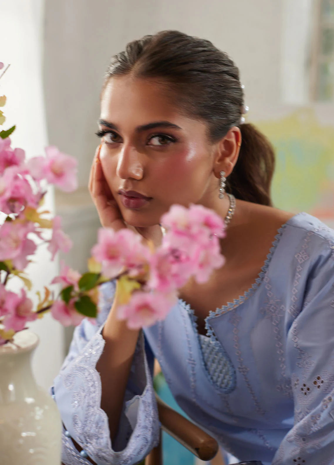 Model wearing powder blue Zorya from Gulaal Lumiere Chikankaari Lawn, Pakistani luxury pret and Pakistani clothes online in UK.