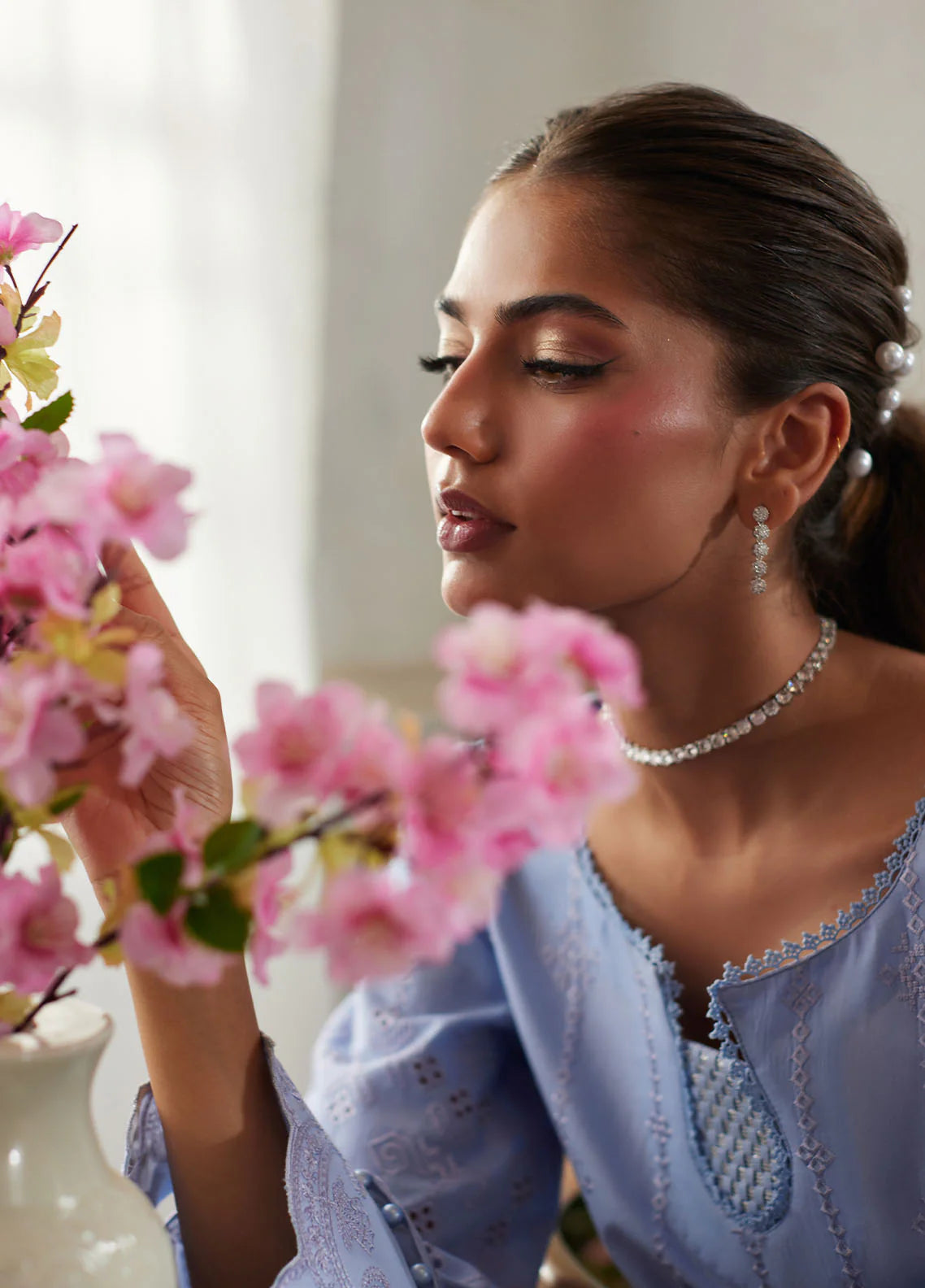 Model wearing powder blue Zorya from Gulaal Lumiere Chikankaari Lawn, Pakistani luxury pret and Pakistani clothes online in UK.