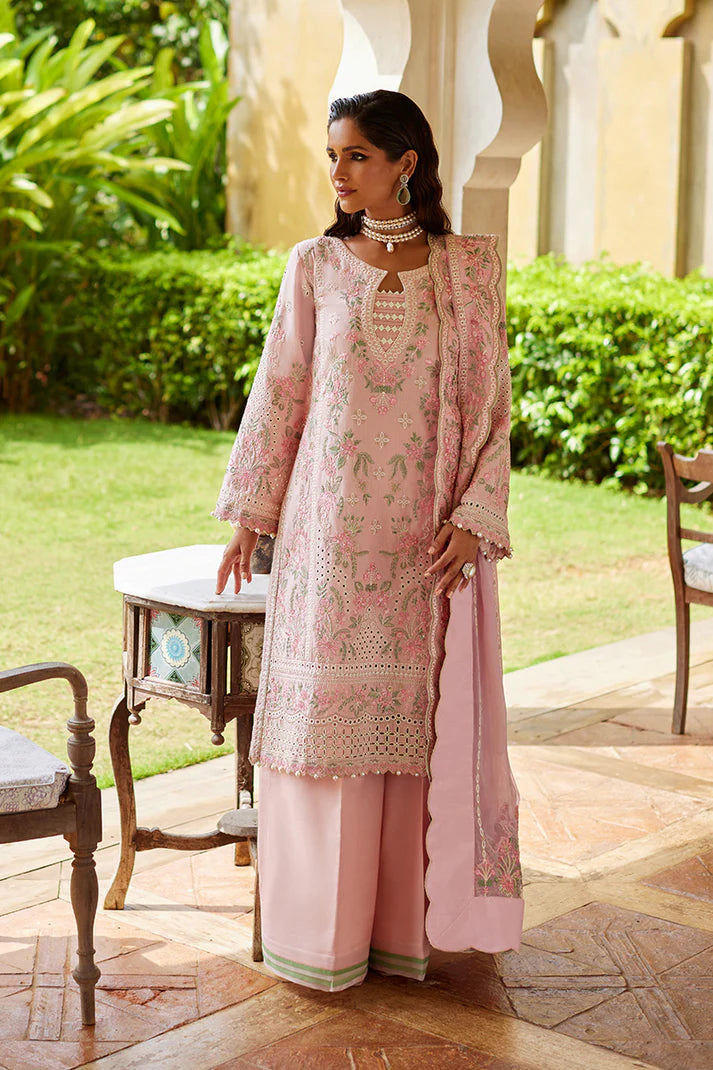 Model wearing Gulaal MAGNOLIA pink luxury lawn dress with delicate embroidery. Shop Pakistani luxury pret online in the UK for elegant fashion.