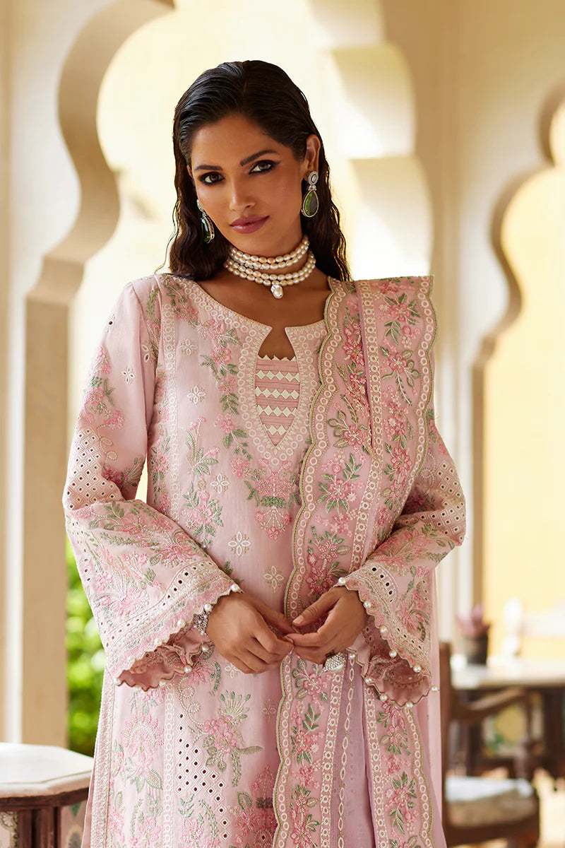 Model wearing Gulaal MAGNOLIA pink luxury lawn dress with delicate embroidery. Shop Pakistani luxury pret online in the UK for elegant fashion.