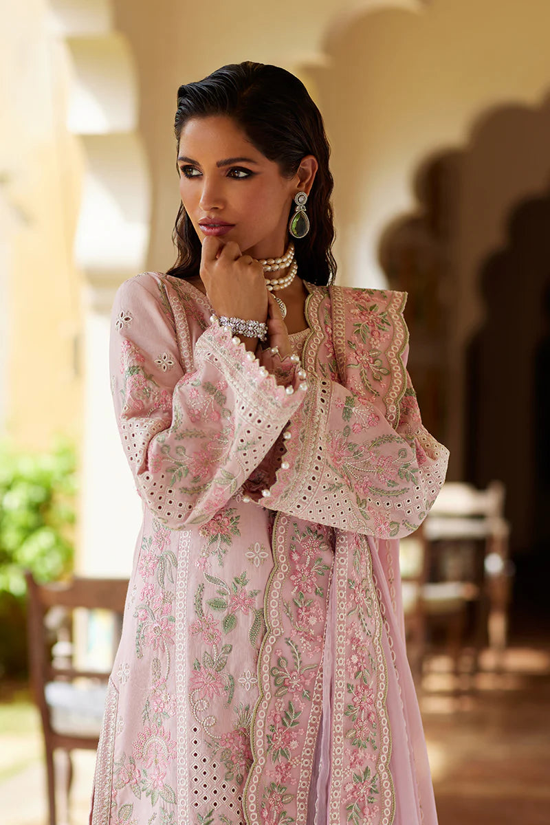 Model wearing Gulaal MAGNOLIA pink luxury lawn dress with delicate embroidery. Shop Pakistani luxury pret online in the UK for elegant fashion.