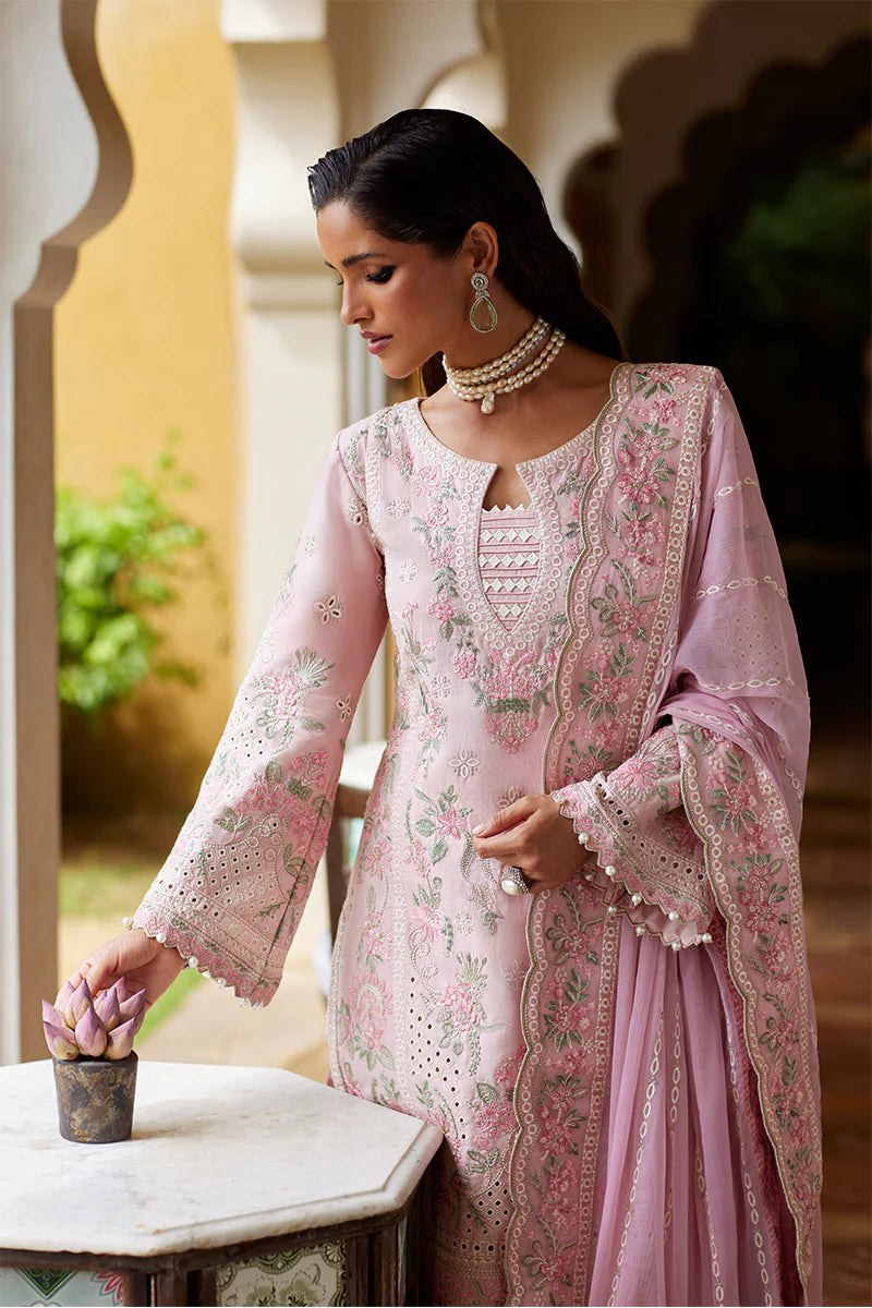 Model wearing Gulaal MAGNOLIA pink luxury lawn dress with delicate embroidery. Shop Pakistani luxury pret online in the UK for elegant fashion.