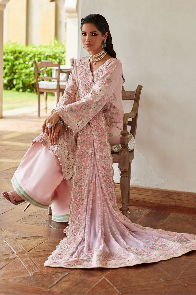 Model wearing Gulaal MAGNOLIA pink luxury lawn dress with delicate embroidery. Shop Pakistani luxury pret online in the UK for elegant fashion.