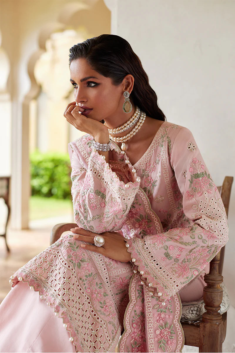 Model wearing Gulaal MAGNOLIA pink luxury lawn dress with delicate embroidery. Shop Pakistani luxury pret online in the UK for elegant fashion.