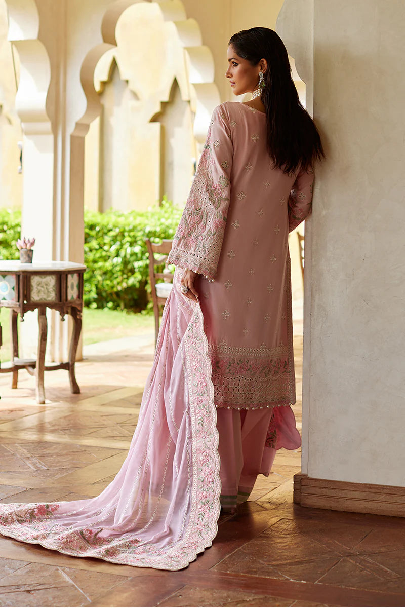 Model wearing Gulaal MAGNOLIA pink luxury lawn dress with delicate embroidery. Shop Pakistani luxury pret online in the UK for elegant fashion.