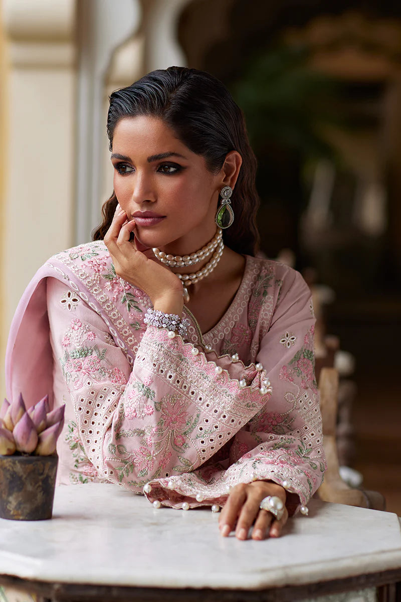 Model wearing Gulaal MAGNOLIA pink luxury lawn dress with delicate embroidery. Shop Pakistani luxury pret online in the UK for elegant fashion.