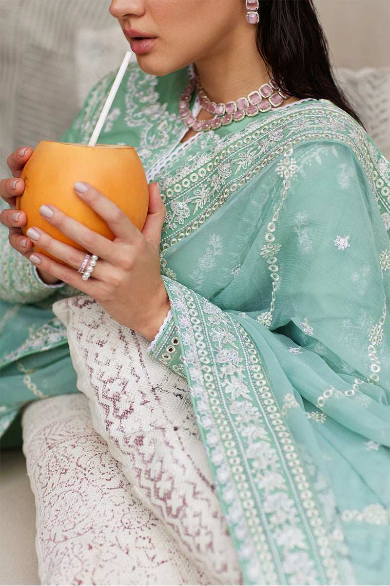 Model wearing Gulaal FREESIA mint green luxury lawn dress with intricate embroidery. Shop Pakistani luxury pret online in the UK for a stylish look.