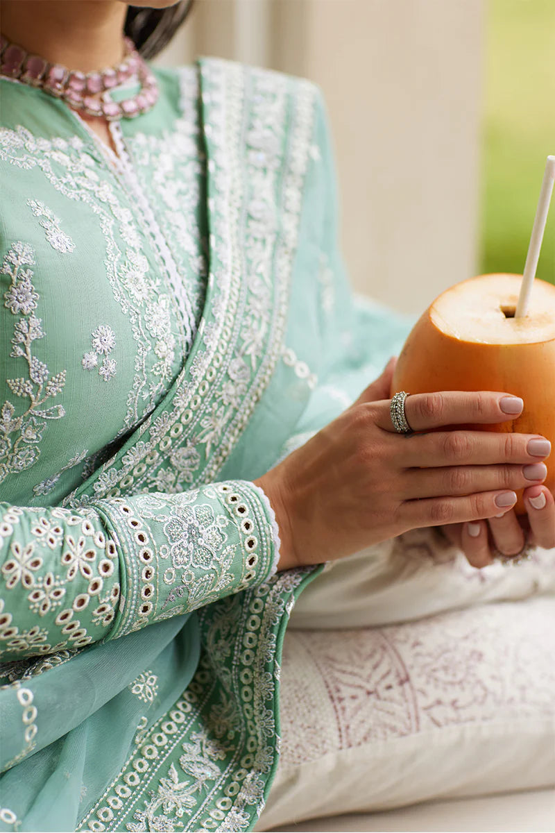 Model wearing Gulaal FREESIA mint green luxury lawn dress with intricate embroidery. Shop Pakistani luxury pret online in the UK for a stylish look.