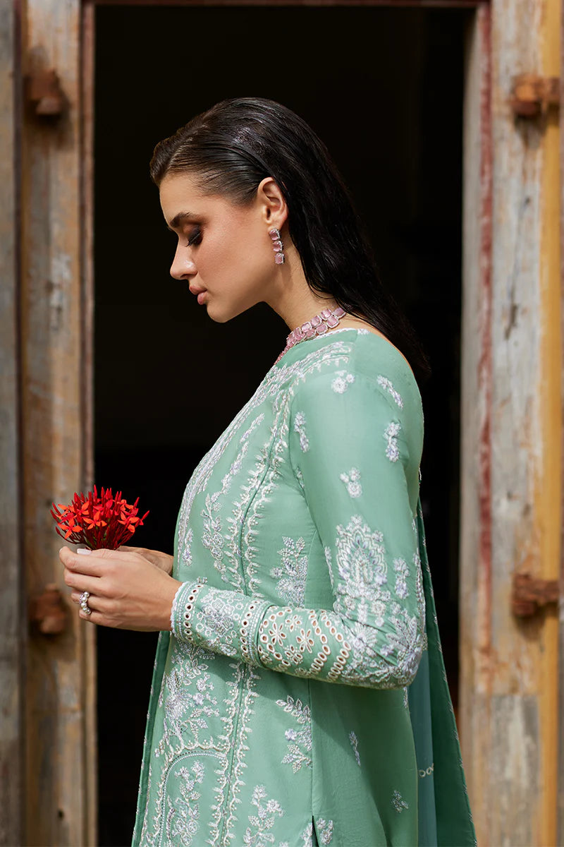 Model wearing Gulaal FREESIA mint green luxury lawn dress with intricate embroidery. Shop Pakistani luxury pret online in the UK for a stylish look.