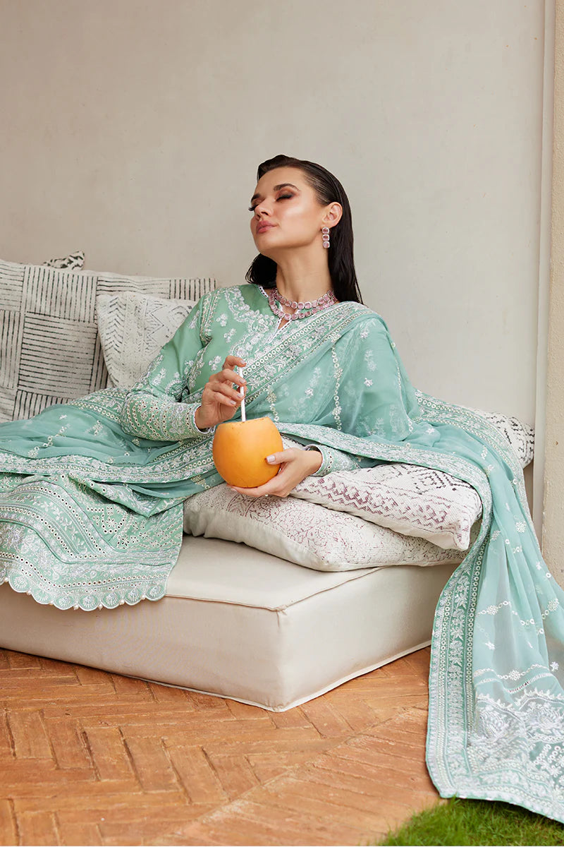 Model wearing Gulaal FREESIA mint green luxury lawn dress with intricate embroidery. Shop Pakistani luxury pret online in the UK for a stylish look.