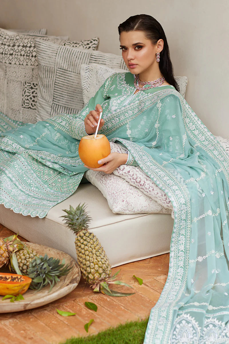 Model wearing Gulaal FREESIA mint green luxury lawn dress with intricate embroidery. Shop Pakistani luxury pret online in the UK for a stylish look.