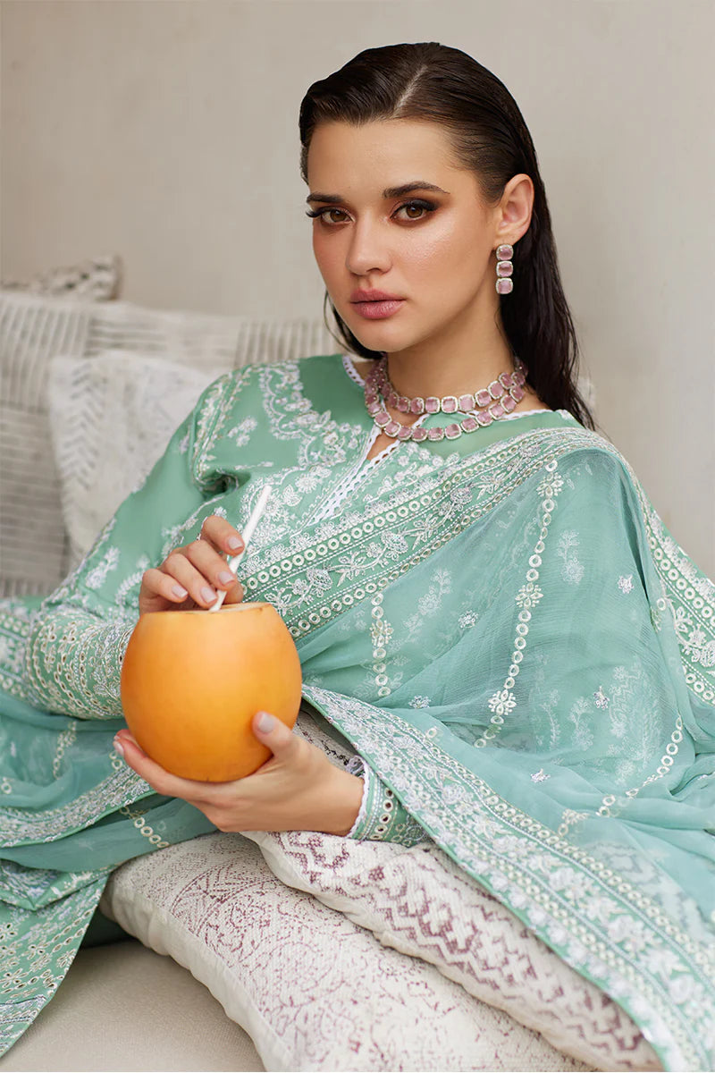 Model wearing Gulaal FREESIA mint green luxury lawn dress with intricate embroidery. Shop Pakistani luxury pret online in the UK for a stylish look.