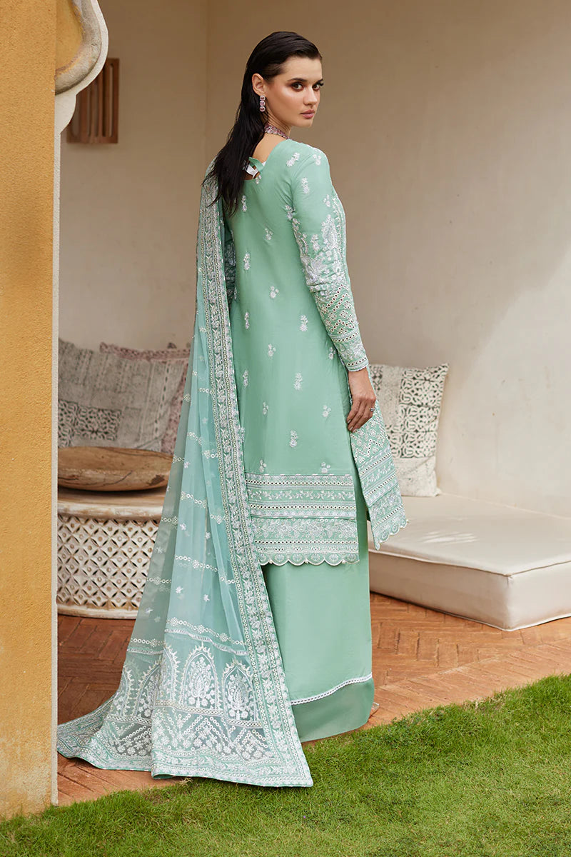 Model wearing Gulaal FREESIA mint green luxury lawn dress with intricate embroidery. Shop Pakistani luxury pret online in the UK for a stylish look.