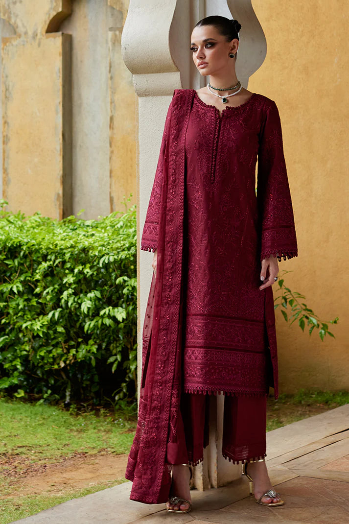 Model wearing Gulaal NIGELLA deep red luxury lawn dress with intricate embroidery. Shop Pakistani luxury pret online in the UK for an elegant look.