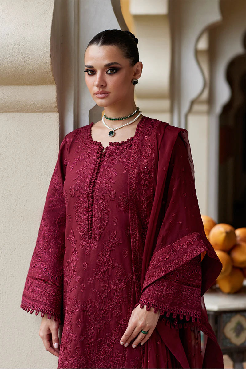 Model wearing Gulaal NIGELLA deep red luxury lawn dress with intricate embroidery. Shop Pakistani luxury pret online in the UK for an elegant look.