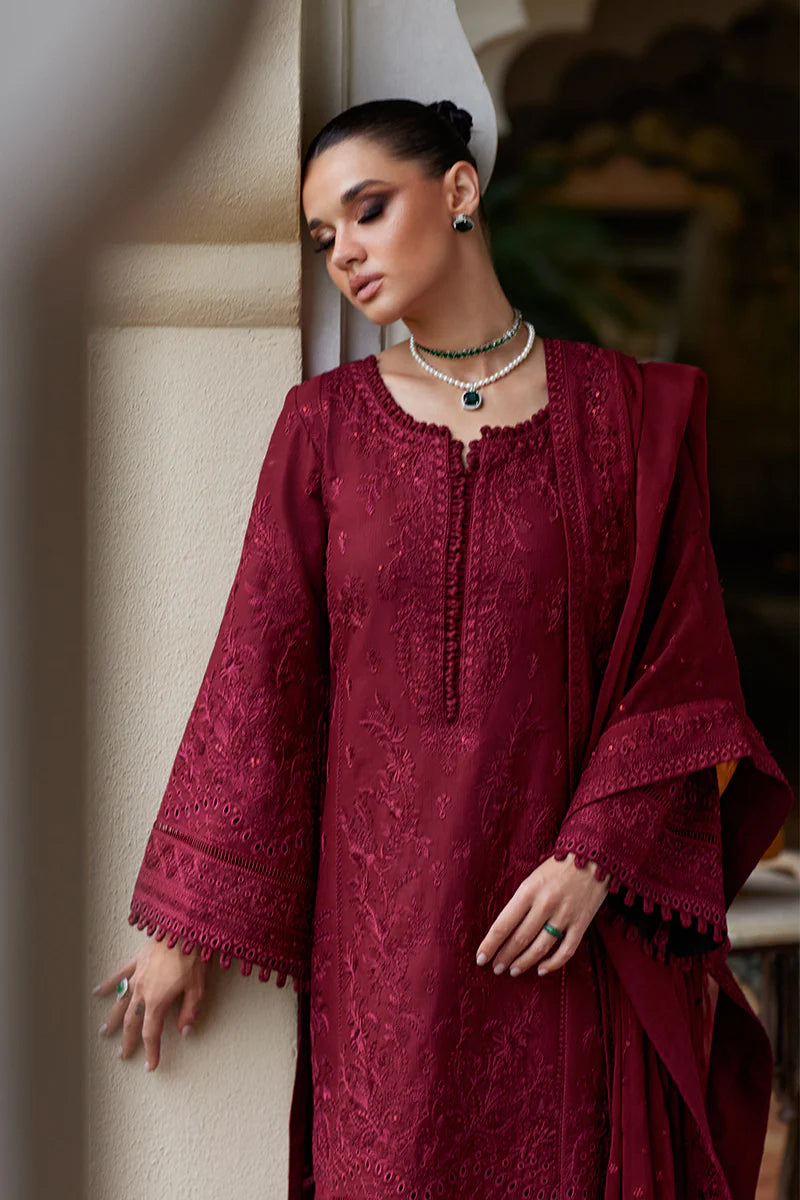 Model wearing Gulaal NIGELLA deep red luxury lawn dress with intricate embroidery. Shop Pakistani luxury pret online in the UK for an elegant look.