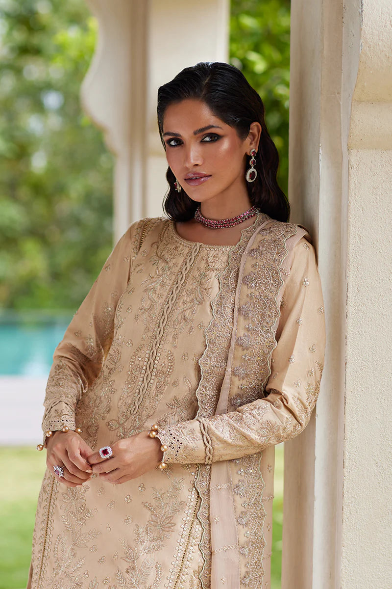 Model wearing Gulaal DAPHNE gold luxury lawn dress with intricate embroidery. Shop Pakistani luxury pret online in the UK for an elegant look.