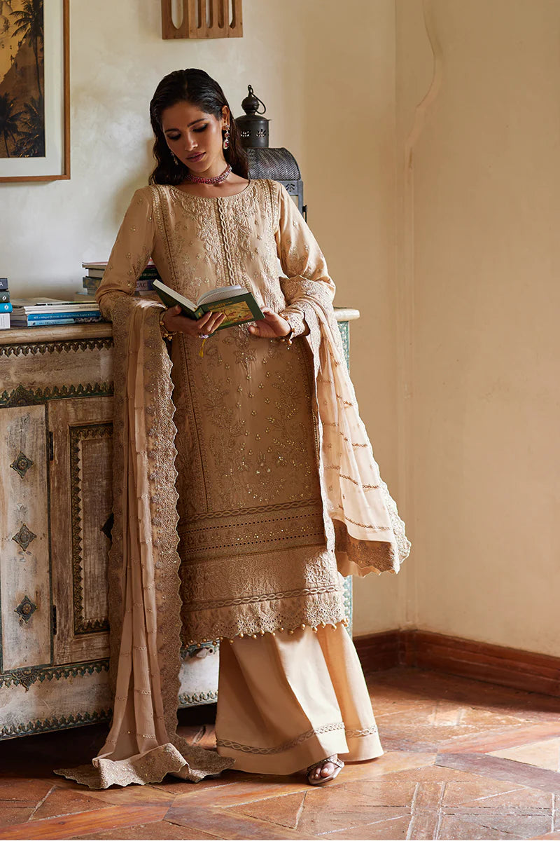 Model wearing Gulaal DAPHNE gold luxury lawn dress with intricate embroidery. Shop Pakistani luxury pret online in the UK for an elegant look.