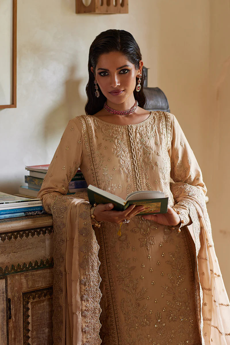 Model wearing Gulaal DAPHNE gold luxury lawn dress with intricate embroidery. Shop Pakistani luxury pret online in the UK for an elegant look.