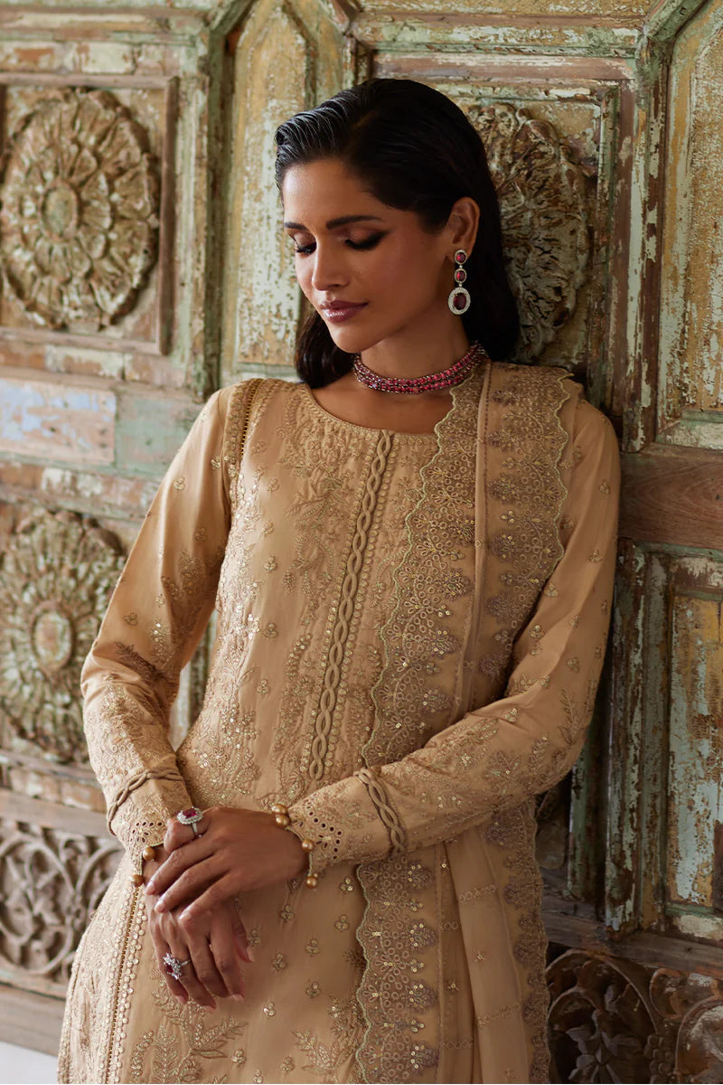 Model wearing Gulaal DAPHNE gold luxury lawn dress with intricate embroidery. Shop Pakistani luxury pret online in the UK for an elegant look.