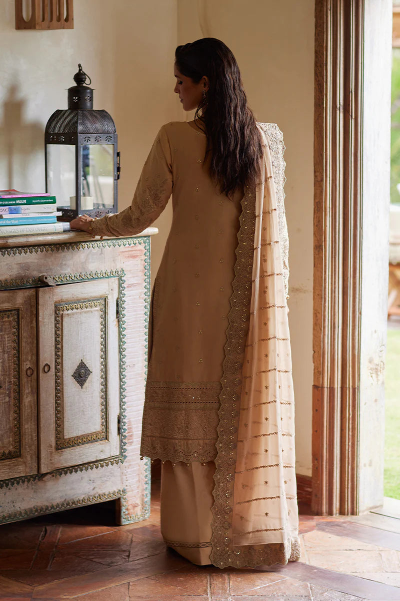 Model wearing Gulaal DAPHNE gold luxury lawn dress with intricate embroidery. Shop Pakistani luxury pret online in the UK for an elegant look.