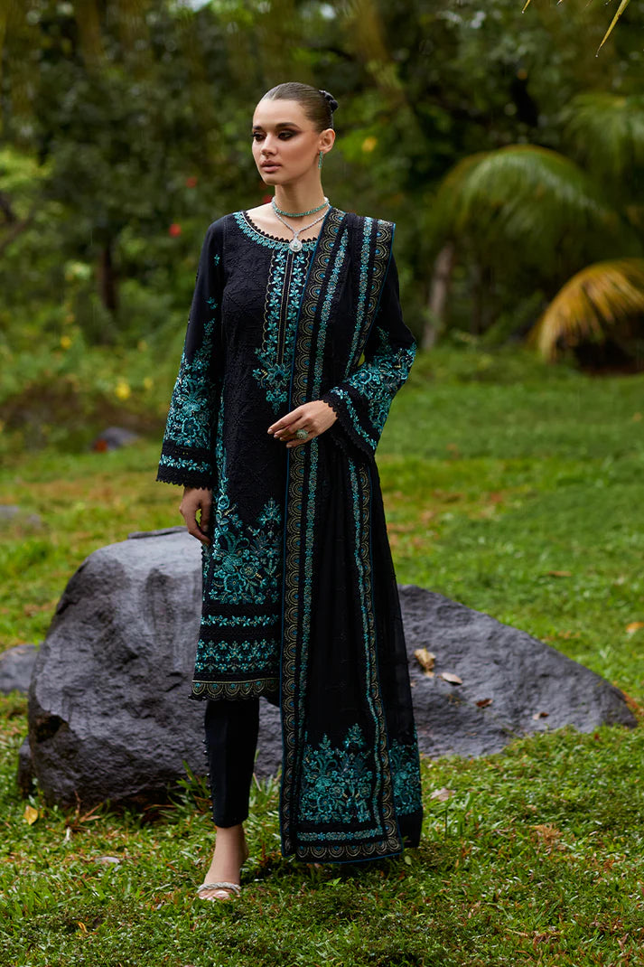 Model wearing Gulaal SCILLA black luxury lawn dress with intricate teal embroidery. Shop Pakistani luxury pret online in the UK for a timeless look.