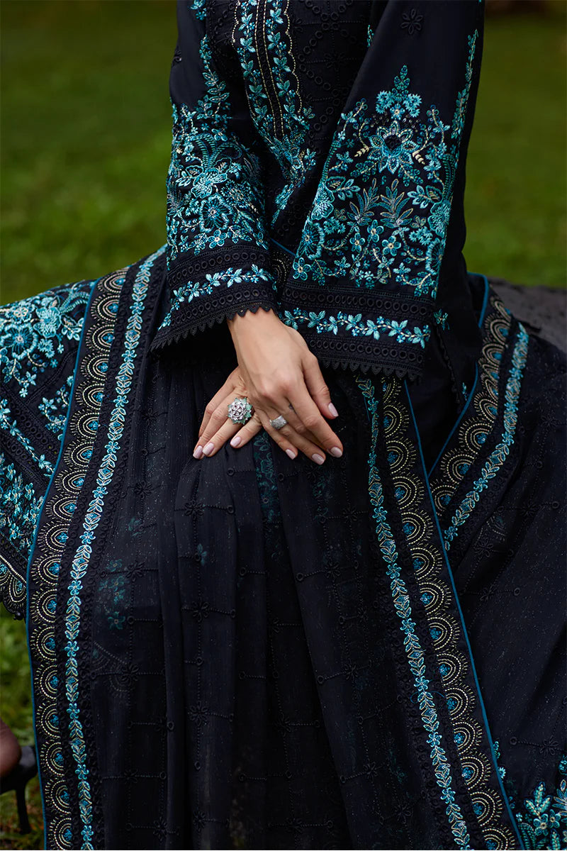 Model wearing Gulaal SCILLA black luxury lawn dress with intricate teal embroidery. Shop Pakistani luxury pret online in the UK for a timeless look.