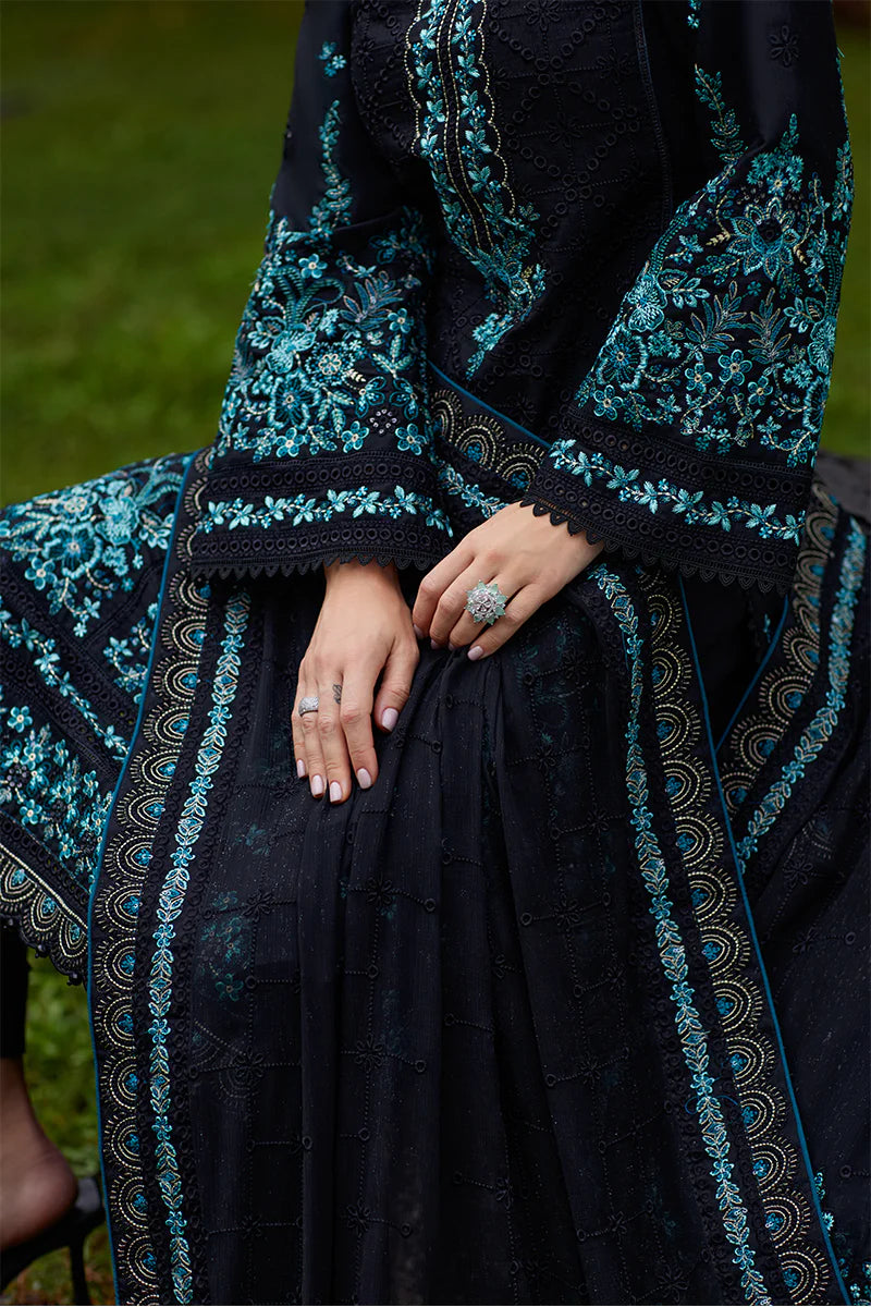 Model wearing Gulaal SCILLA black luxury lawn dress with intricate teal embroidery. Shop Pakistani luxury pret online in the UK for a timeless look.