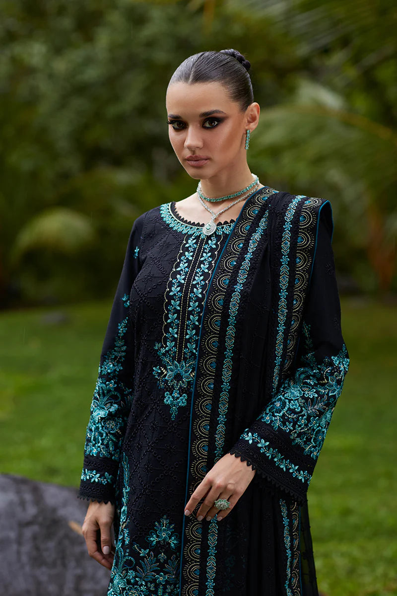 Model wearing Gulaal SCILLA black luxury lawn dress with intricate teal embroidery. Shop Pakistani luxury pret online in the UK for a timeless look.