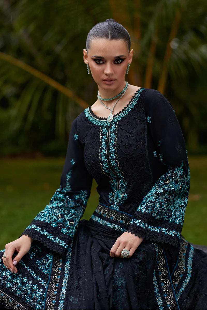 Model wearing Gulaal SCILLA black luxury lawn dress with intricate teal embroidery. Shop Pakistani luxury pret online in the UK for a timeless look.