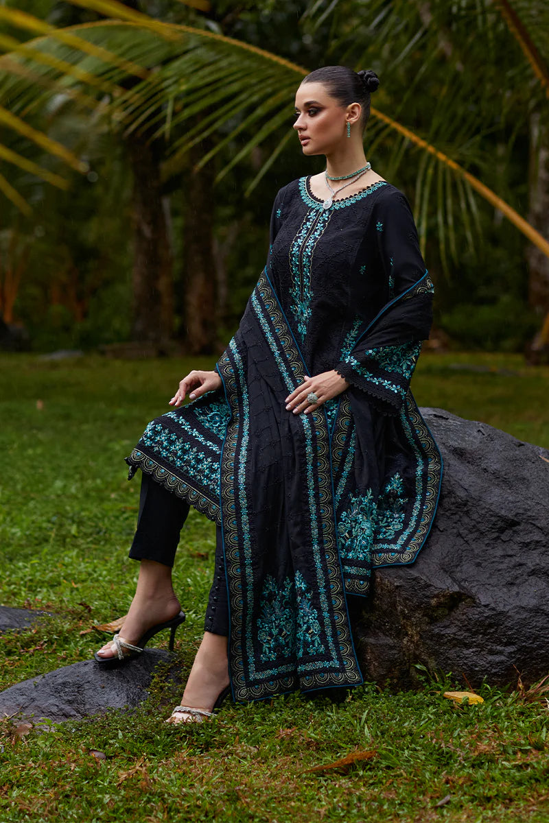 Model wearing Gulaal SCILLA black luxury lawn dress with intricate teal embroidery. Shop Pakistani luxury pret online in the UK for a timeless look.