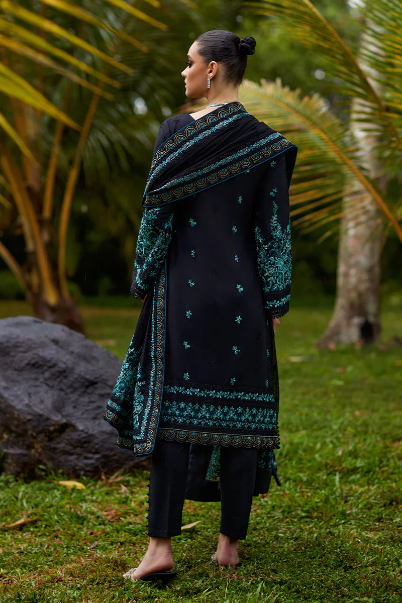 Model wearing Gulaal SCILLA black luxury lawn dress with intricate teal embroidery. Shop Pakistani luxury pret online in the UK for a timeless look.