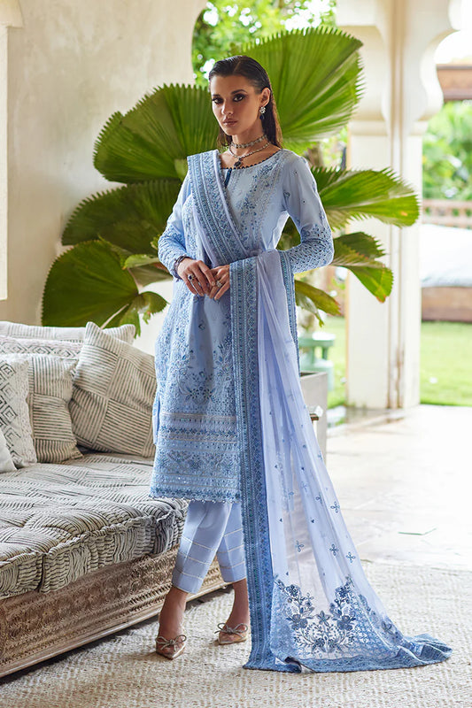 Model wearing Gulaal AZALEA blue luxury lawn dress with intricate embroidery. Shop Pakistani luxury pret online in the UK for timeless elegance.