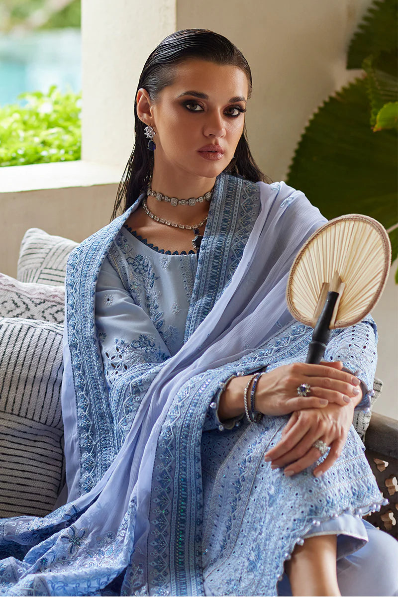 Model wearing Gulaal AZALEA blue luxury lawn dress with intricate embroidery. Shop Pakistani luxury pret online in the UK for timeless elegance.